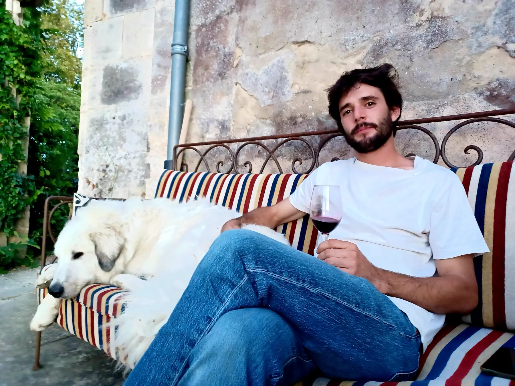 A relaxed moment on a bench with the dog